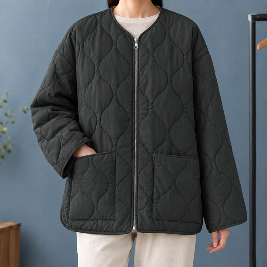 Black quilted collarless zip jacket with patch pockets