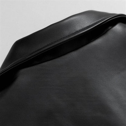 Oversized leather bomber jacket, detail of the collar and shoulder