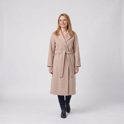 Woman wearing the belted long coat with lapel collar and side pockets