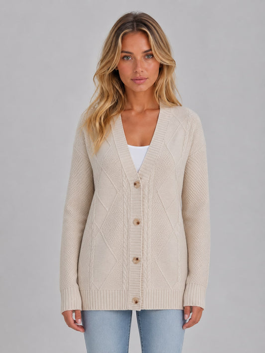Model wearing the beige cable knit cardigan buttoned, front view