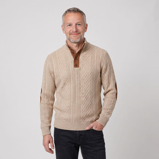 Man wearing the cable knit jumper with button stand collar and elbow patches