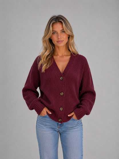 Burgundy chunky knit button cardigan worn by model with jeans