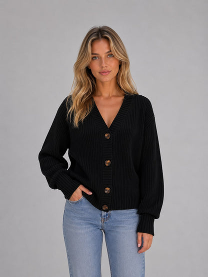 Model wearing the black chunky knit button cardigan
