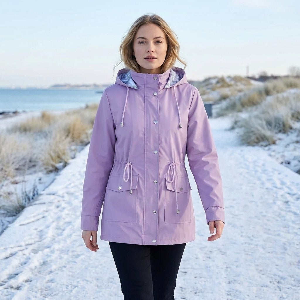 Lilac drawstring waist hooded parka worn outdoors