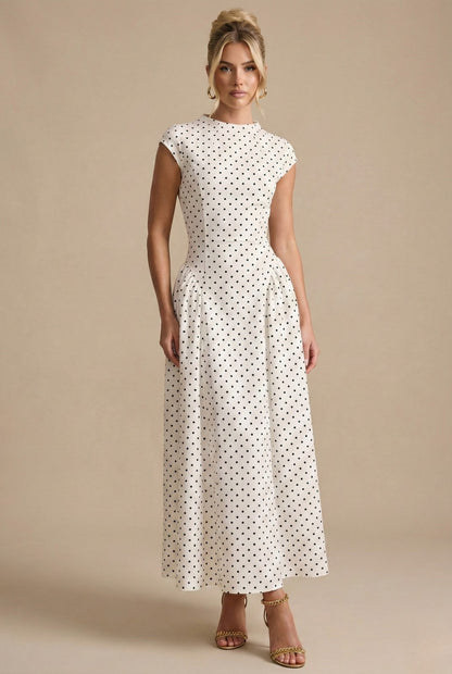 Model in the ivory polka dot maxi dress, full length front view