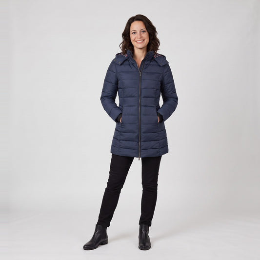 Woman wearing a navy fitted long quilted puffer jacket with hood