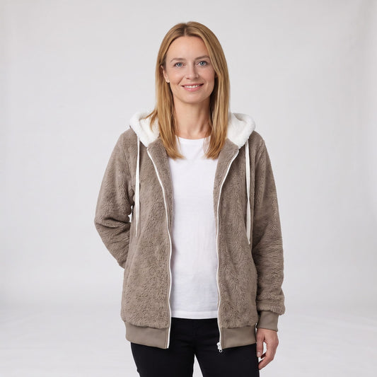 Woman wearing a taupe fluffy fleece zip up hooded jacket