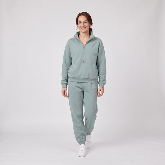 Woman wearing the fleece half zip sweatshirt and joggers lounge set