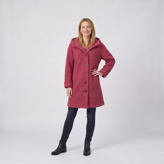 Woman wearing the hooded textured winter coat with button front
