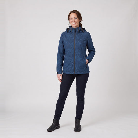 Woman wearing the leaf print hooded rain jacket with zip pockets