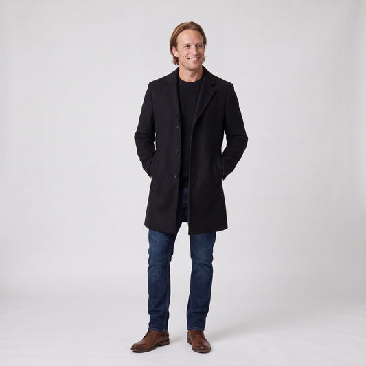 Man wearing the single breasted long overcoat with notch lapel and flap pockets