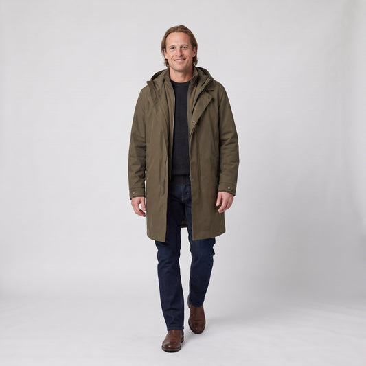 Man wearing the long hooded rain coat with layered front