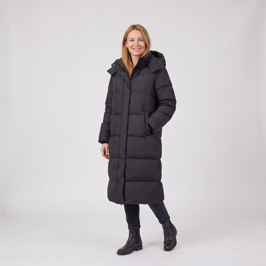 Woman wearing the long hooded maxi puffer jacket with down filling