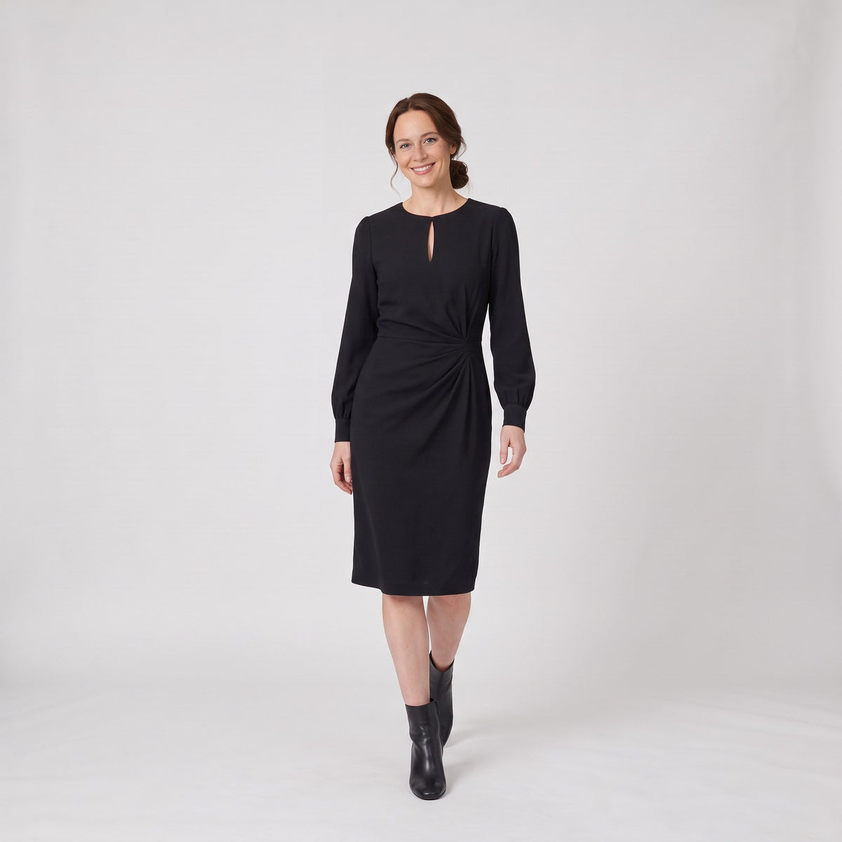 Woman wearing the long sleeve winter midi dress with keyhole neckline