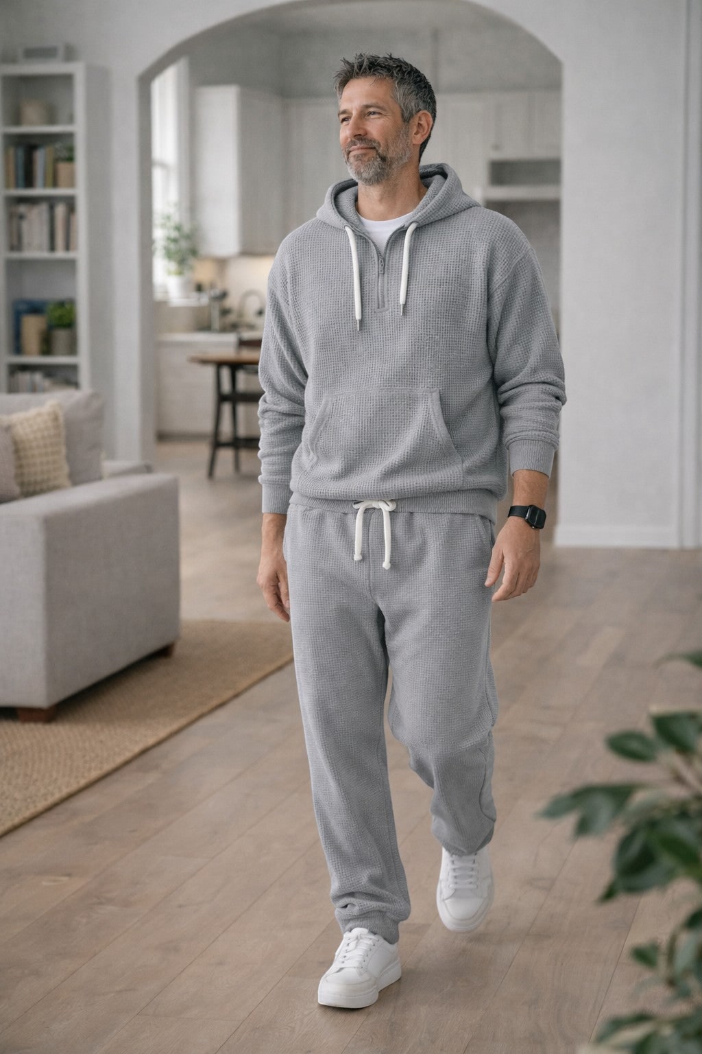 Grey half zip hoodie and joggers worn indoors