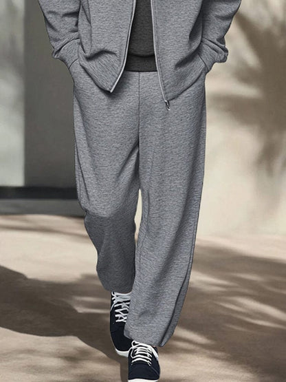 Grey straight leg trousers, close up