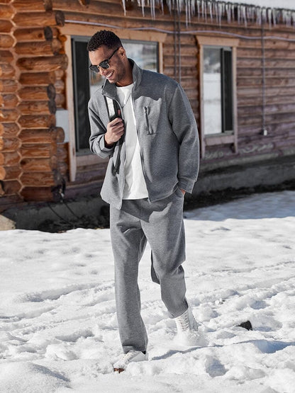 Grey jacket and trousers set worn in the snow