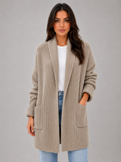 Model wearing the taupe longline cardigan open over a white top and jeans