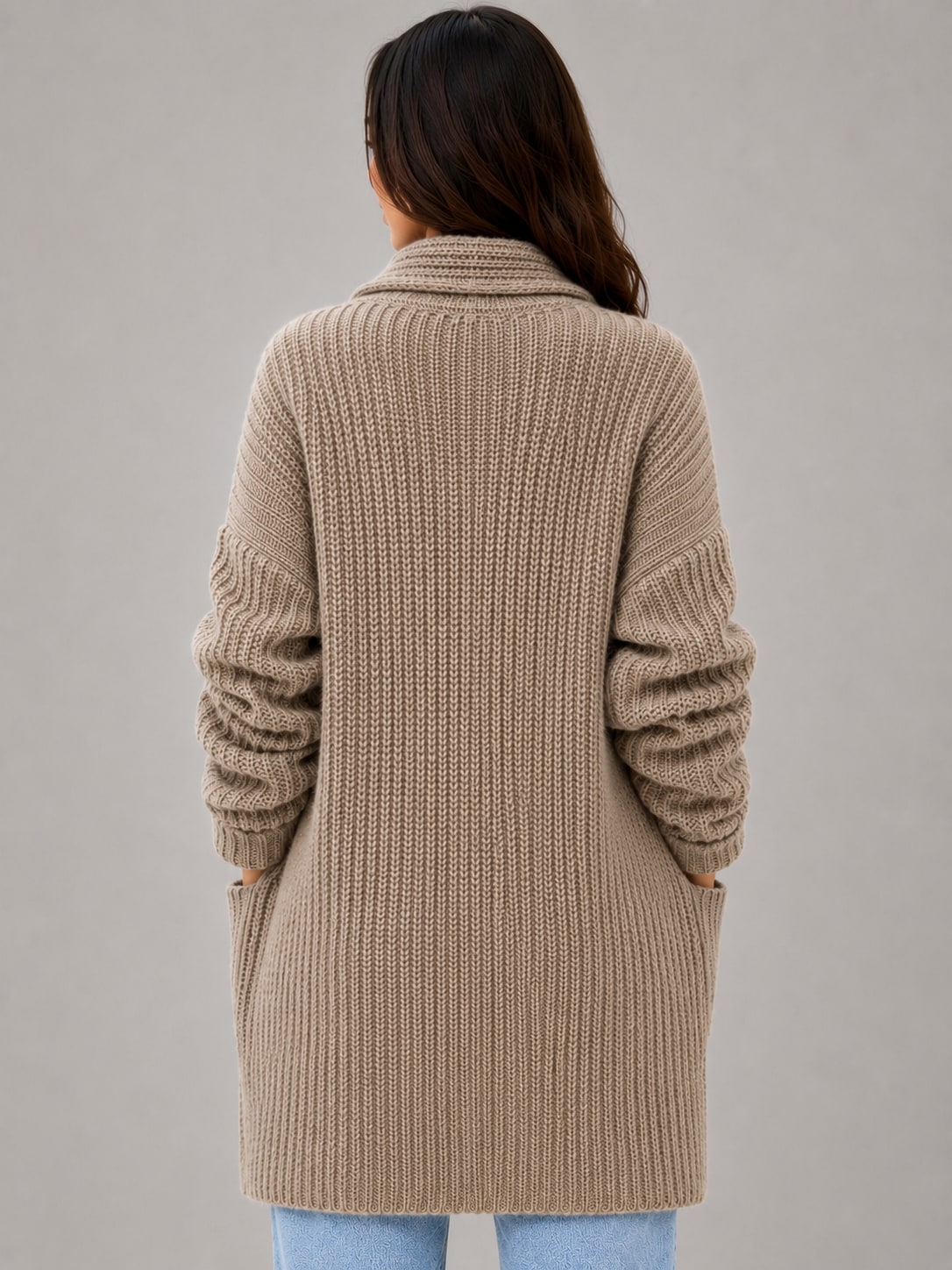 Back view of the taupe longline cardigan showing the rib knit and shawl collar