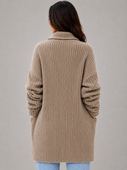 Back view of the taupe longline cardigan showing the rib knit and shawl collar