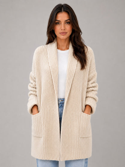 Model in the beige longline cardigan with hands in the front patch pockets