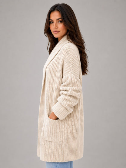 Side view of the beige longline cardigan showing the relaxed length