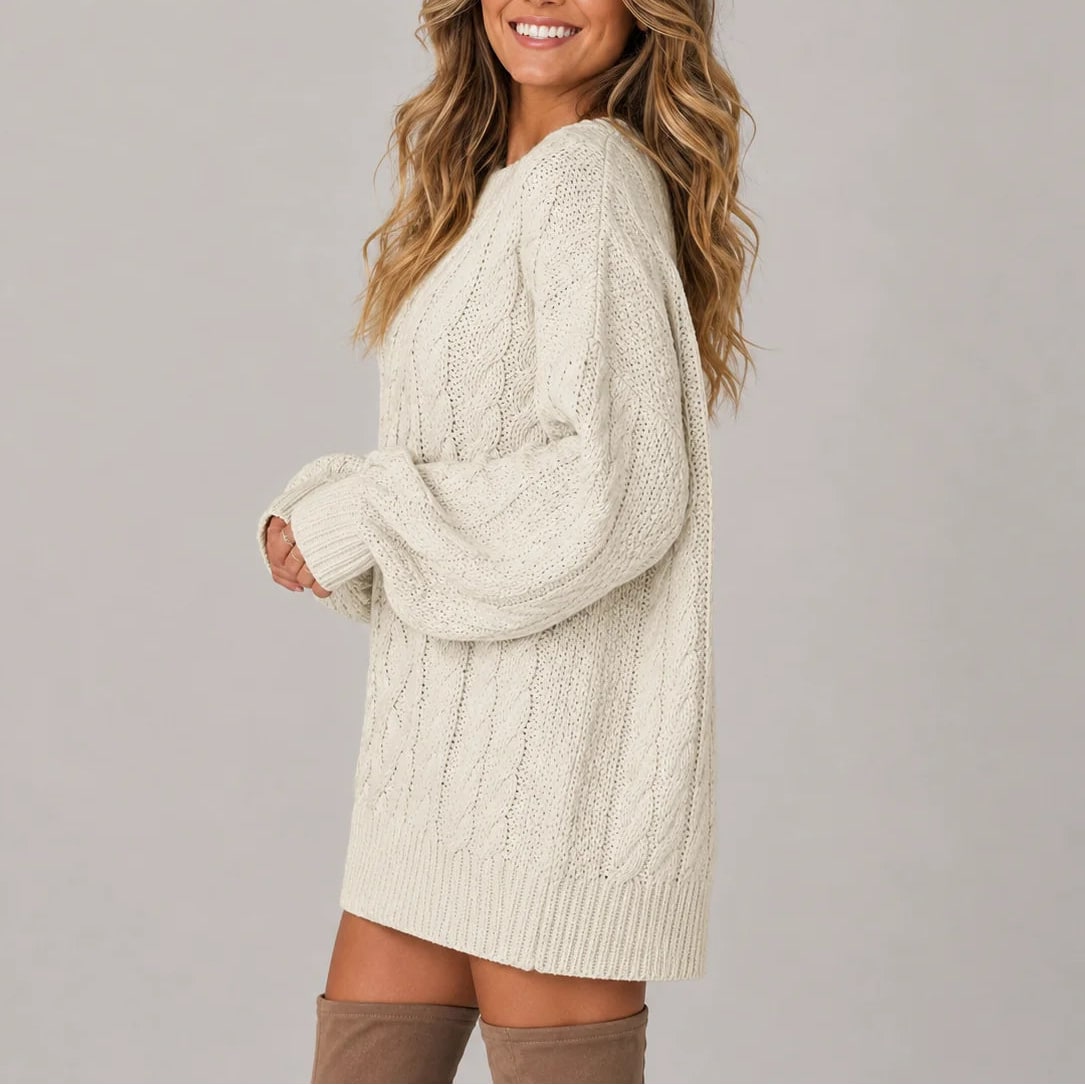 Cream cable knit jumper dress, side view showing the balloon sleeves