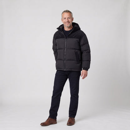 Man wearing the oversized hooded puffer jacket with corduroy yoke