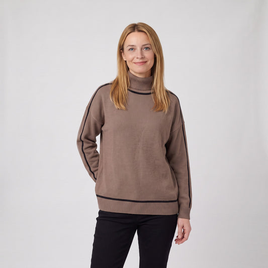 Woman wearing the oversized roll neck jumper with contrast trim