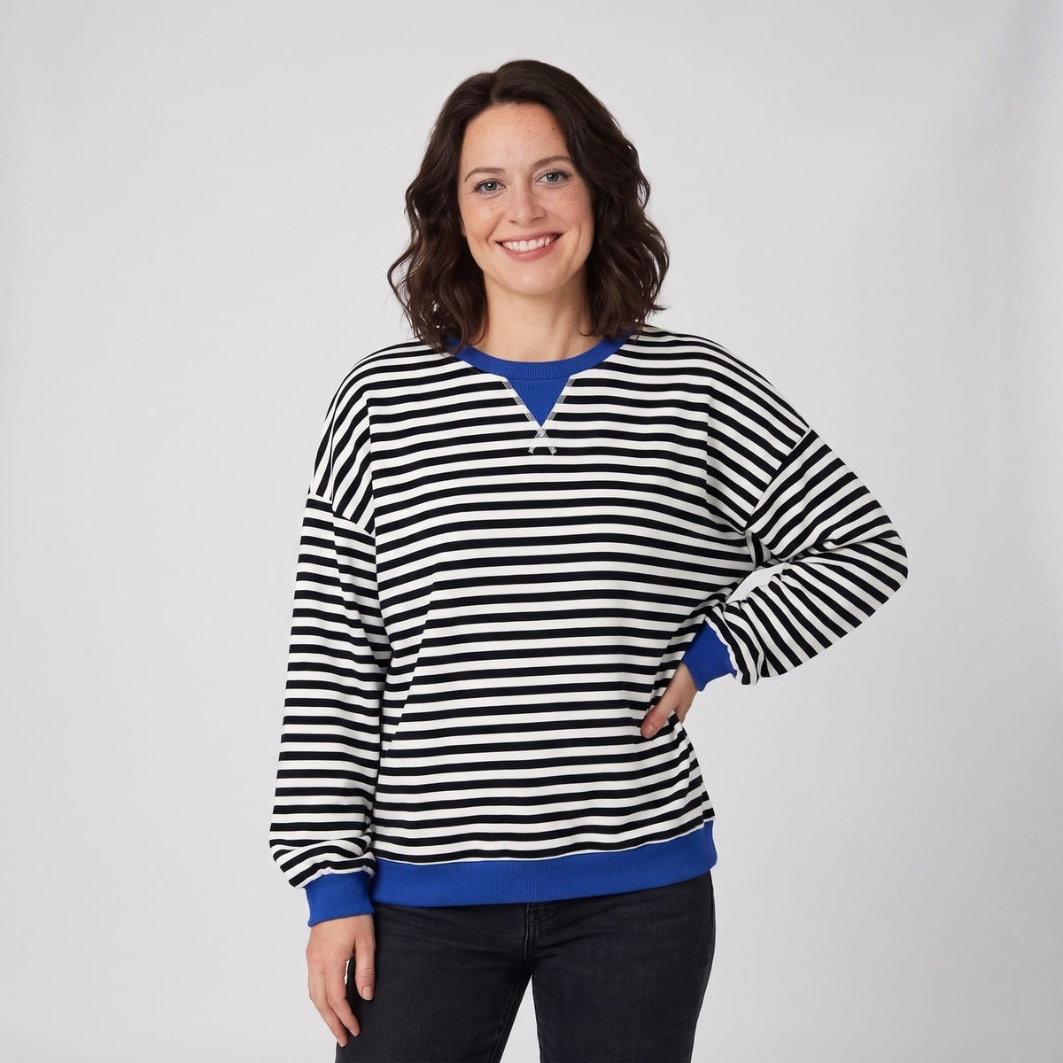 Black and white striped oversized crew neck sweater with blue contrast trim