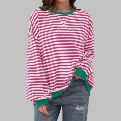 Pink striped oversized sweater with green trim