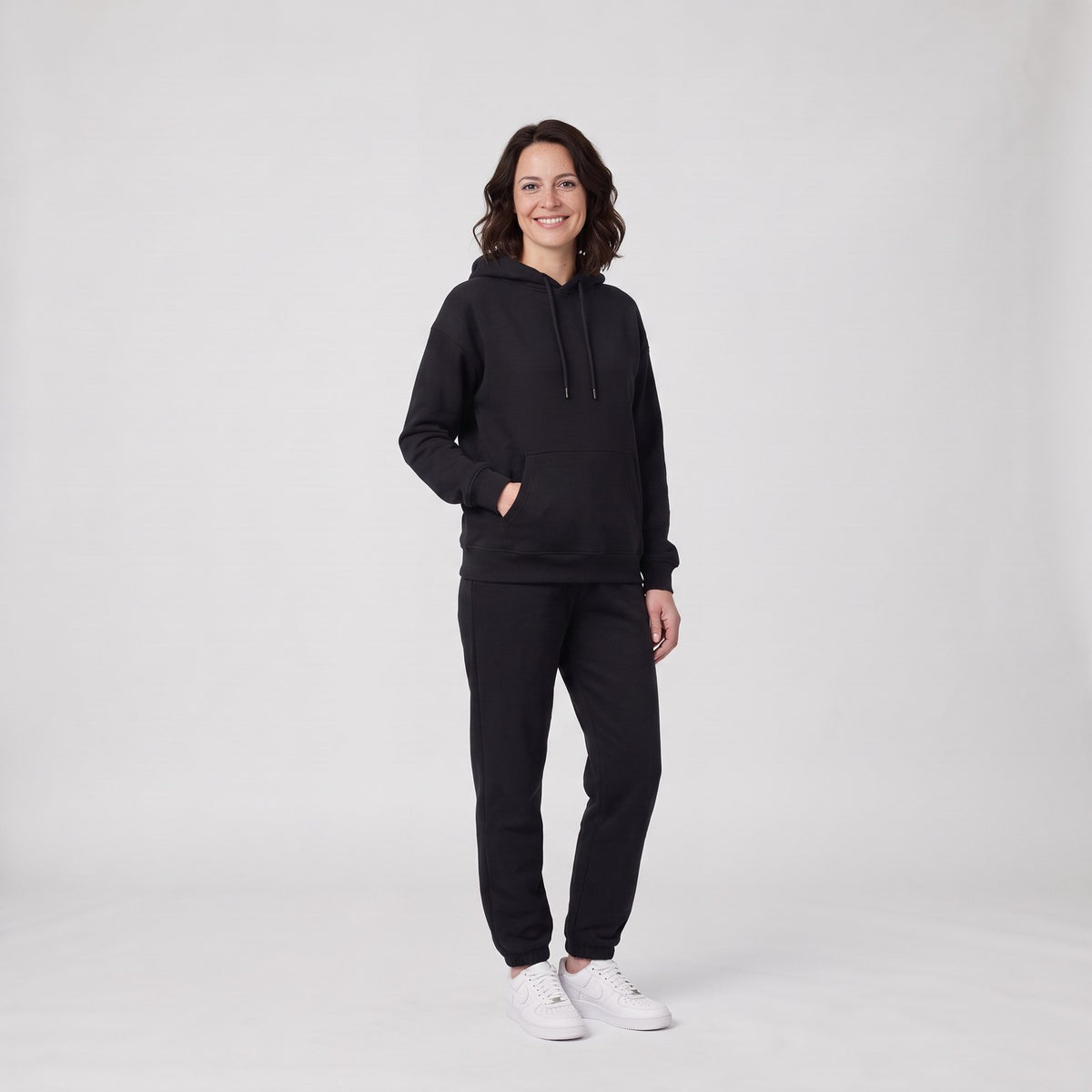 Woman wearing the relaxed hooded jogging suit tracksuit set