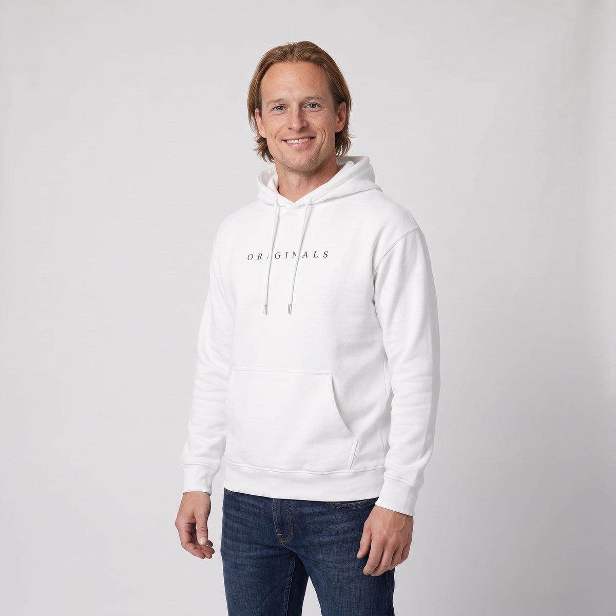 Man wearing the relaxed hoodie with minimal chest print