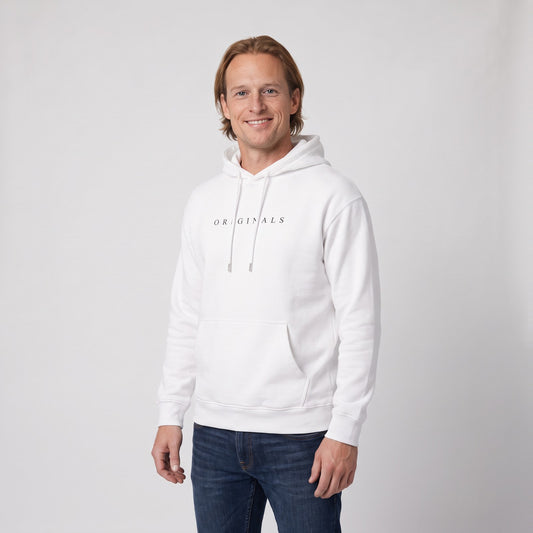 Man wearing the relaxed hoodie with minimal chest print