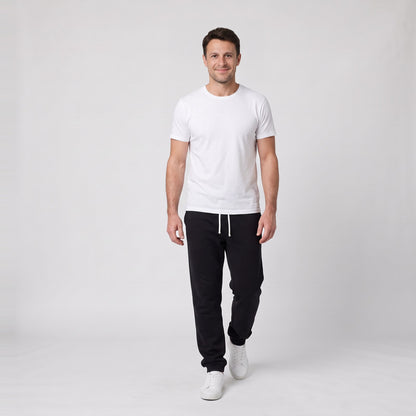 Man wearing the relaxed knit joggers with drawstring waist