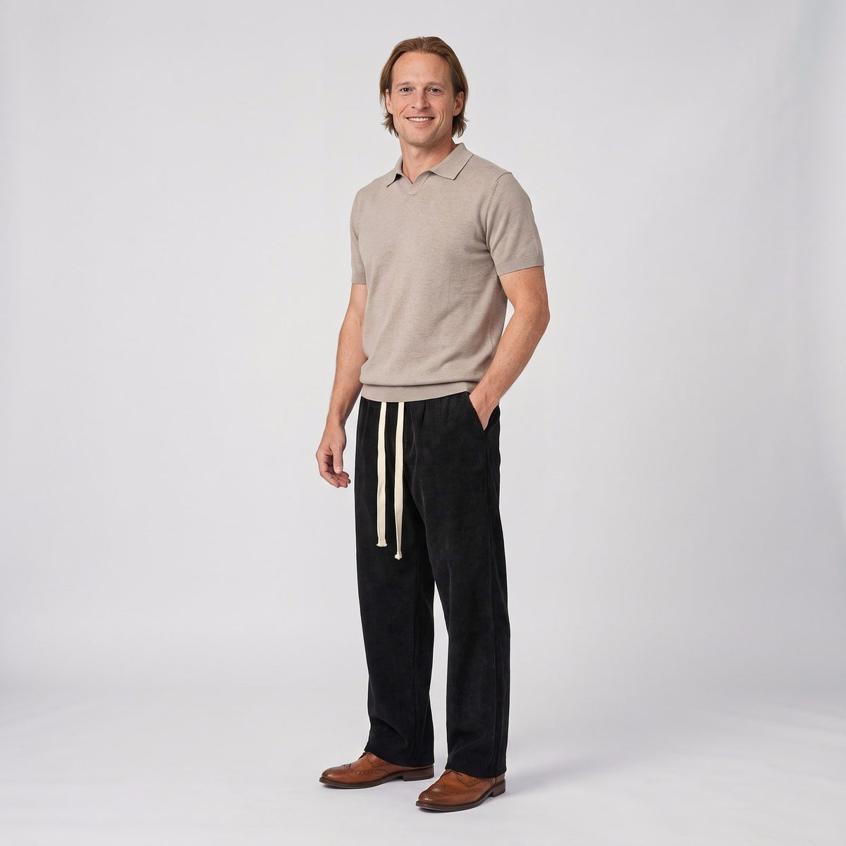 Black relaxed wide leg corduroy texture trousers with tasselled drawstring