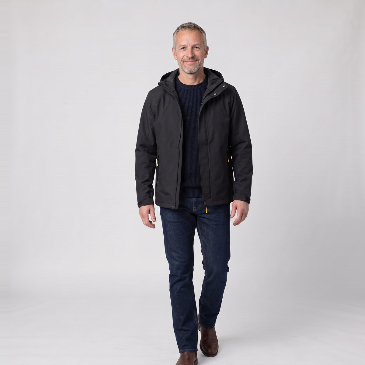 Man wearing the slim fit hooded rain jacket with zip pockets