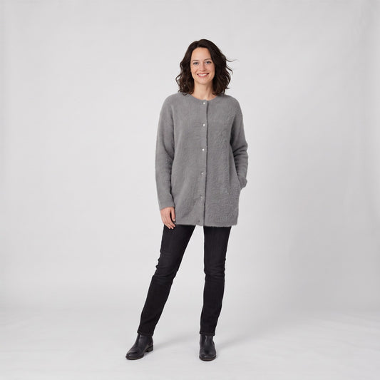 Woman wearing the soft fluffy longline button cardigan with round neck