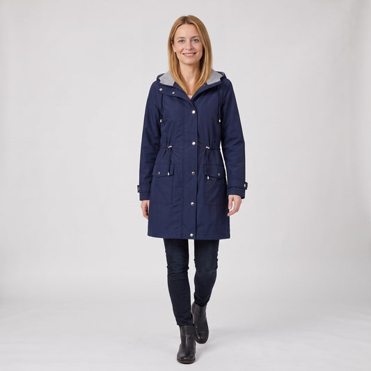 Woman wearing the waterproof long hooded rain coat with drawstring waist and striped lining