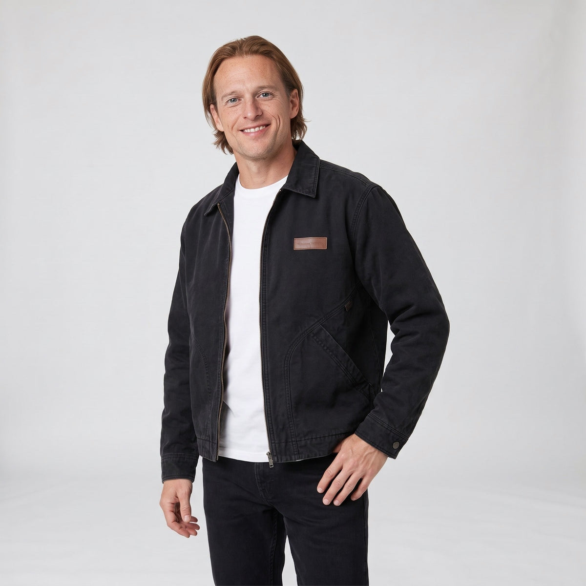 Black washed canvas workwear jacket with zip front and leather patch