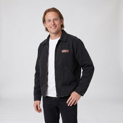 Black washed canvas workwear jacket with zip front and leather patch