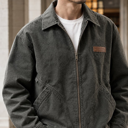 Workwear jacket close up of the leather patch and canvas texture